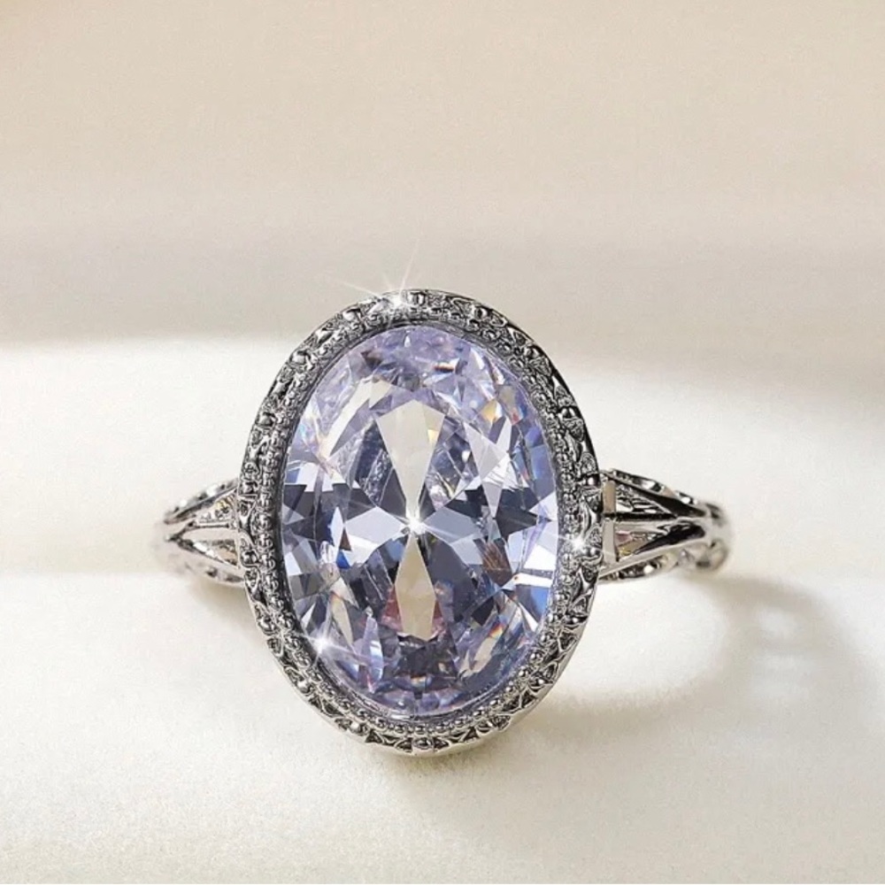 NWOT. Bezel-set, storm blue CZ cocktail/occasion ring in 925 plate.